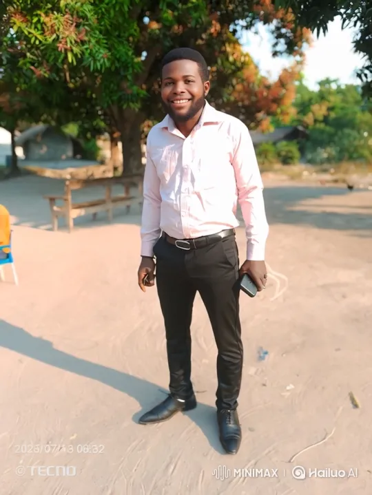 Young Man Smiling Outdoors with Smartphone – AI Generated Video | Hailuo AI