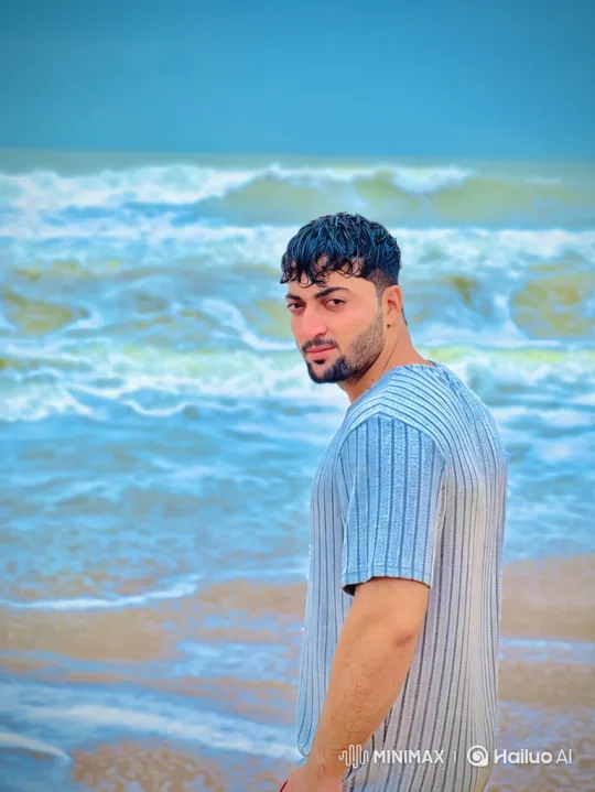Young Man Watches Ocean Waves on Beach – AI Generated Video | Hailuo AI
