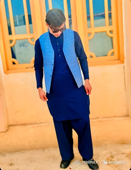 Young Man in Blue Vest Contemplating Outdoors – AI Generated Video | Hailuo AI