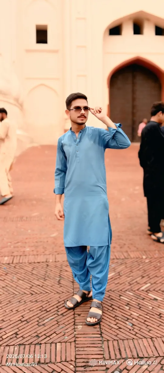 Young Man Observes Arrival of Black Sedan at Historic Building – AI Generated Video | Hailuo AI