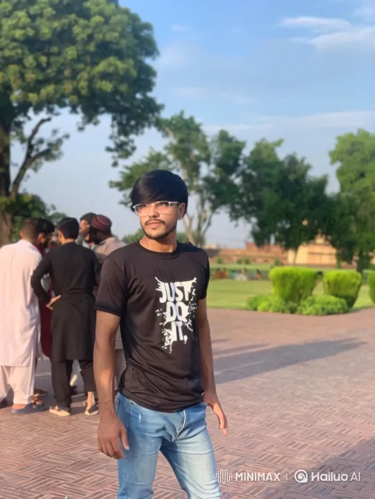 Young Man Observes Two Women Walking in Park – AI Generated Video | Hailuo AI