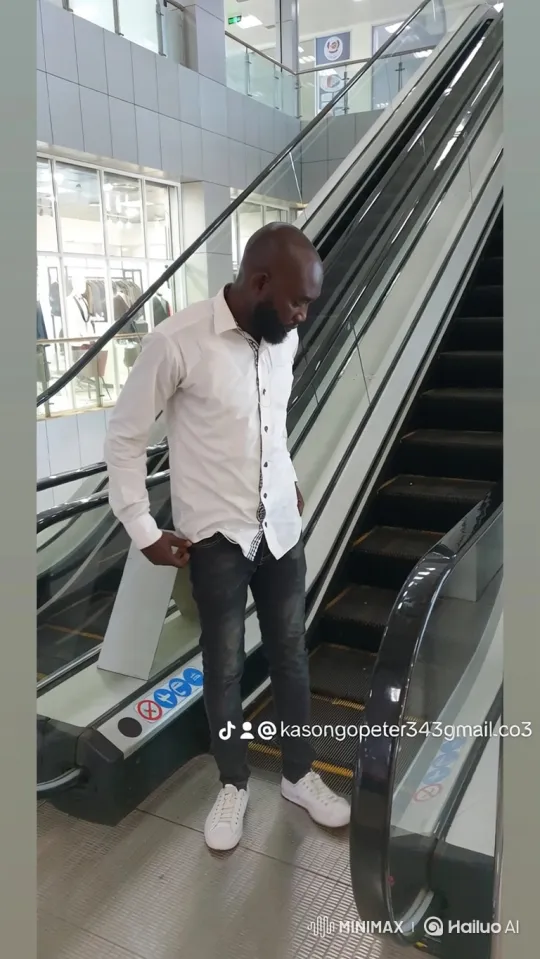 Bald Bearded Man Observes Modern Building Interiors – AI Generated Video | Hailuo AI