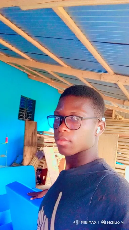 Young Man Examines Workshop in Dynamic Camera Move – AI Generated Video | Hailuo AI