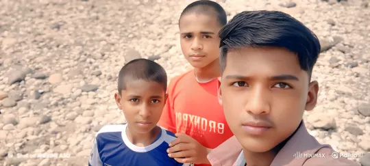 Three Boys on Shoreline in Reflective Moment – AI Generated Video | Hailuo AI