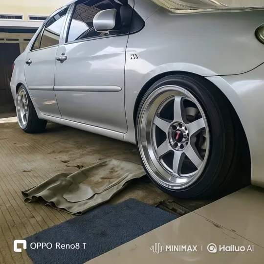 Silver Sedan Demonstrates Subtle Air Suspension Lowering – AI Generated Video | Hailuo AI
