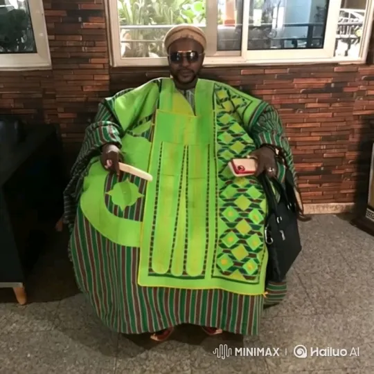 Man in Green Robe Prepares to Drive Yellow Sports Car – AI Generated Video | Hailuo AI