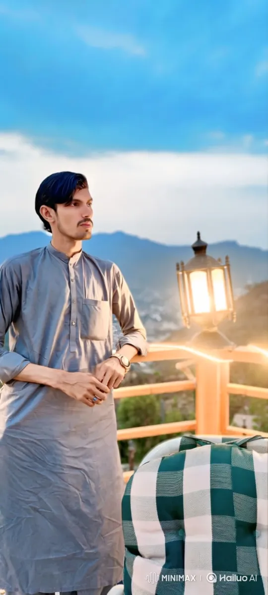 Young Man's Journey to a Tranquil Mountain View – AI Generated Video | Hailuo AI