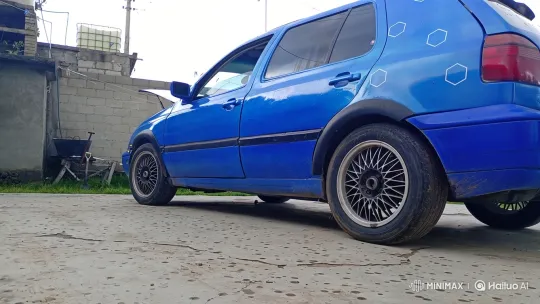 Vibrant Blue Hatchback with Custom Wheels and Air Suspension – AI Generated Video | Hailuo AI