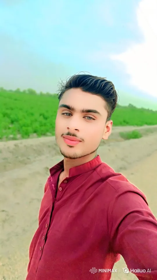 Young Man's Serene Gaze in Pastoral Setting – AI Generated Video | Hailuo AI