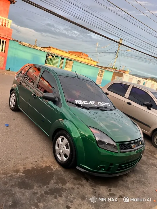 Green Hatchback Drives Down Urban Street – AI Generated Video | Hailuo AI