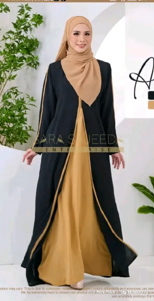 Woman Models Elegant Black and Tan Garment in Minimalist Setting – AI Generated Video | Hailuo AI