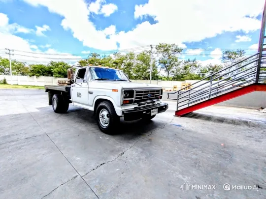 White Truck Drives Away in Open Concrete Lot – AI Generated Video | Hailuo AI