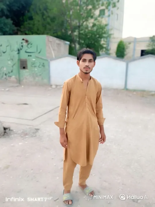 Young Man in Traditional Attire Amidst Graffiti and Nature – AI Generated Video | Hailuo AI