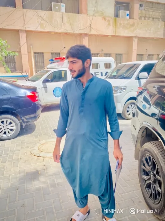 Young Man Walks Across Courtyard with Tracking Shot – AI Generated Video | Hailuo AI