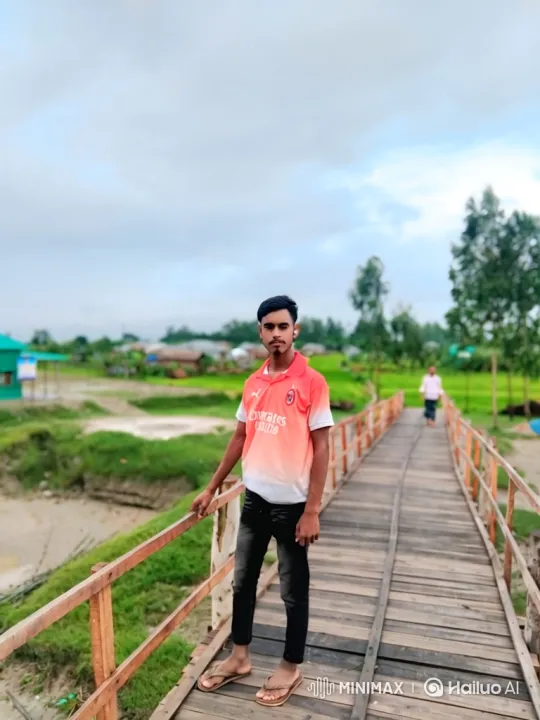 Young Man Observes Passing Airplane on Wooden Bridge – AI Generated Video | Hailuo AI