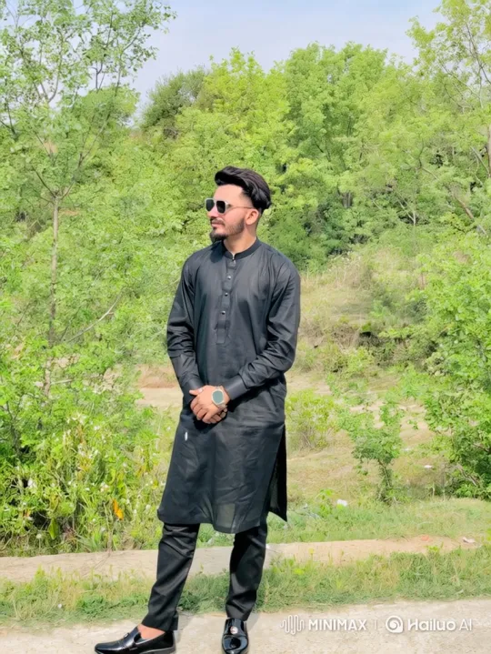Stylish Young Man in Nature: A Moment of Serenity – AI Generated Video | Hailuo AI