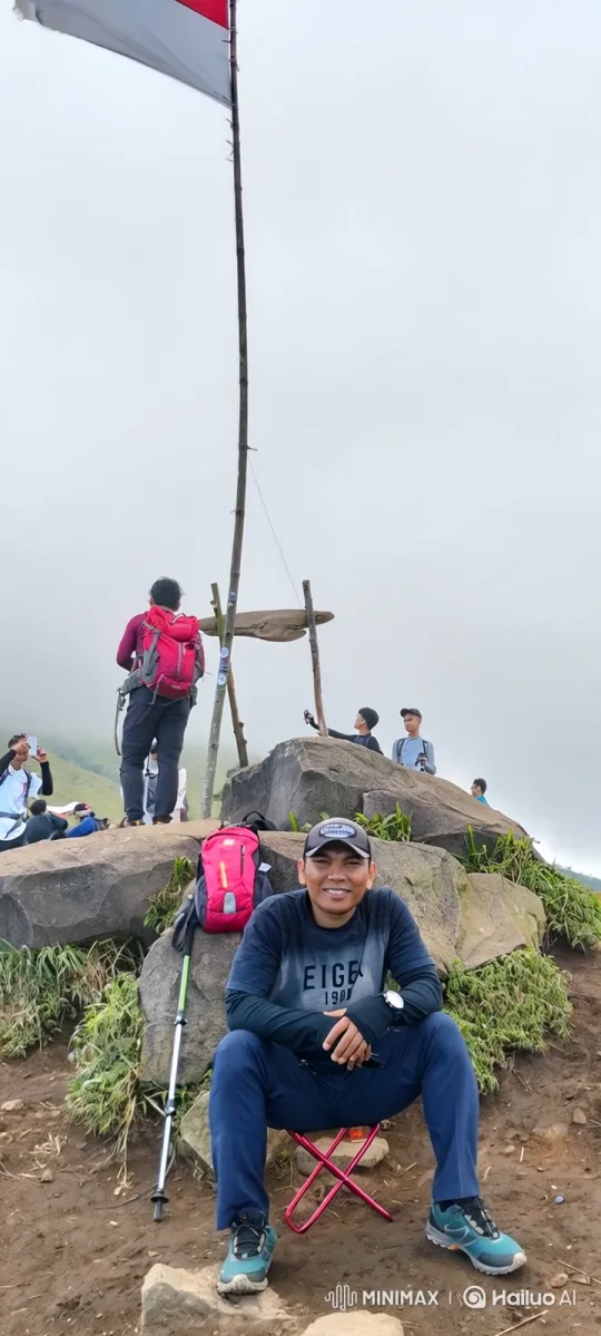 Hiker Enjoying Mountain Summit in Thick Fog – AI Generated Video | Hailuo AI