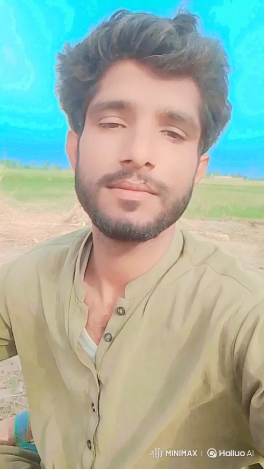 Young Man's Subtle Smile in Serene Outdoor Setting – AI Generated Video | Hailuo AI