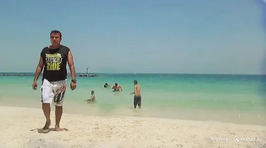 Man Walks Towards Camera on a Sandy Beach – AI Generated Video | Hailuo AI
