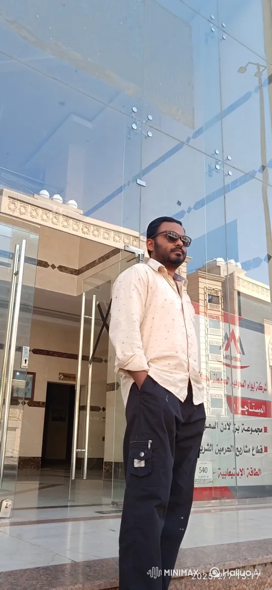 Man Enters Luxury Sedan in Front of Modern Building – AI Generated Video | Hailuo AI