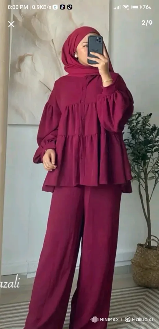 Woman Models Maroon Outfit in Sunlit Garden – AI Generated Video | Hailuo AI