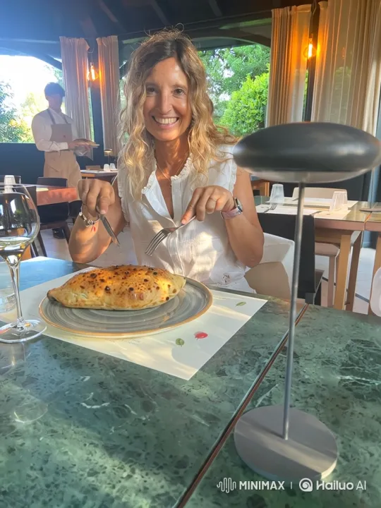 Woman Enjoying and Presenting a Calzone in a Bright Restaurant – AI Generated Video | Hailuo AI
