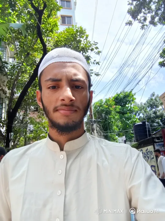 Young Man in Crocheted Cap Smiles Gently Outdoors – AI Generated Video | Hailuo AI