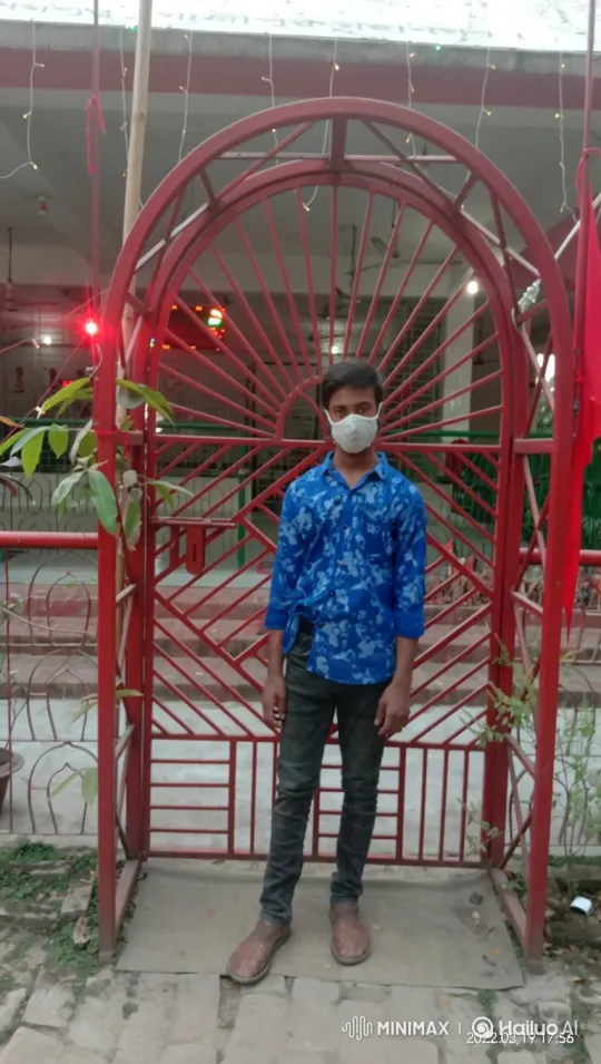 Young Man Spins Like a Helicopter Through Red Gate – AI Generated Video | Hailuo AI