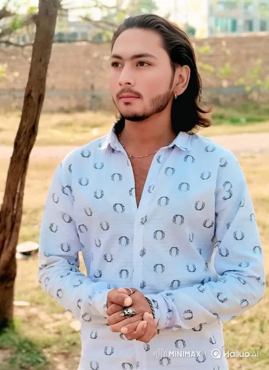 Young Man Reflects Calmly in Sunlit Outdoor Setting – AI Generated Video | Hailuo AI