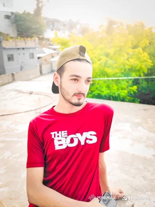 Young Man Smiles Warmly on Rooftop with Cityscape – AI Generated Video | Hailuo AI