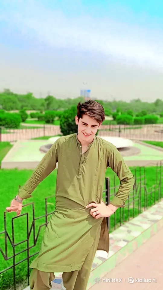 Young Man Smiling in a Park Setting – AI Generated Video | Hailuo AI