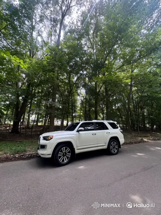 White SUV Showcased Amidst Lush Forest Scenery – AI Generated Video | Hailuo AI