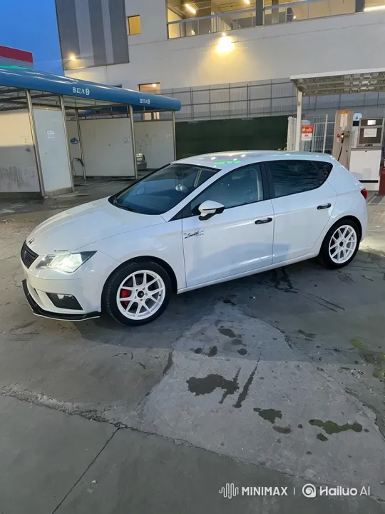 White Hatchback with Custom Wheels at Car Wash – AI Generated Video | Hailuo AI