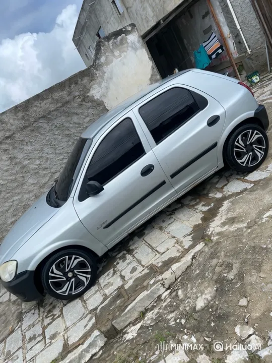 Custom Silver Hatchback Lowers on Cobblestone Driveway – AI Generated Video | Hailuo AI