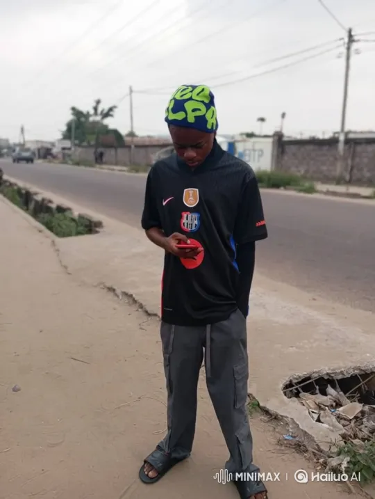 Young Man on Sidewalk Smiles at Camera – AI Generated Video | Hailuo AI