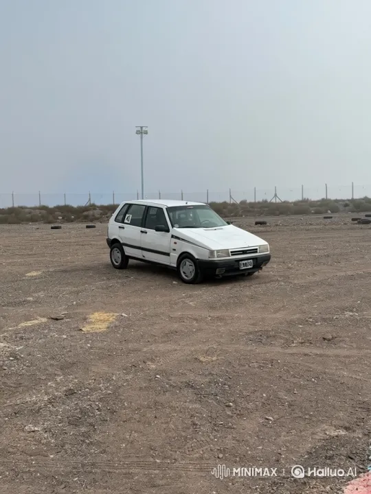 White Hatchback's Slow Descent into Low-Rider Stance – AI Generated Video | Hailuo AI