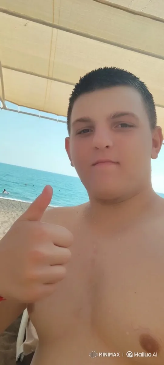 Young Man Kisses Older Man on Beach – AI Generated Video | Hailuo AI