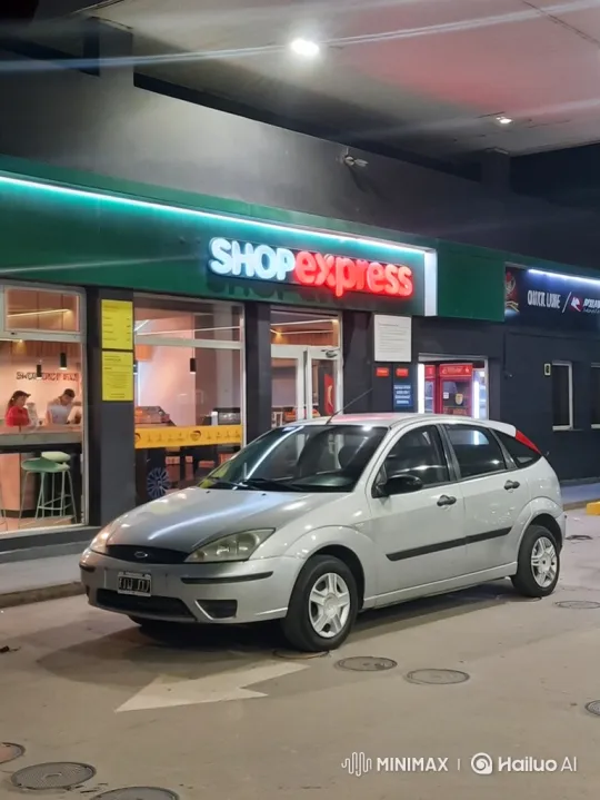 Silver Hatchback Lowers Smoothly at Night Gas Station – AI Generated Video | Hailuo AI