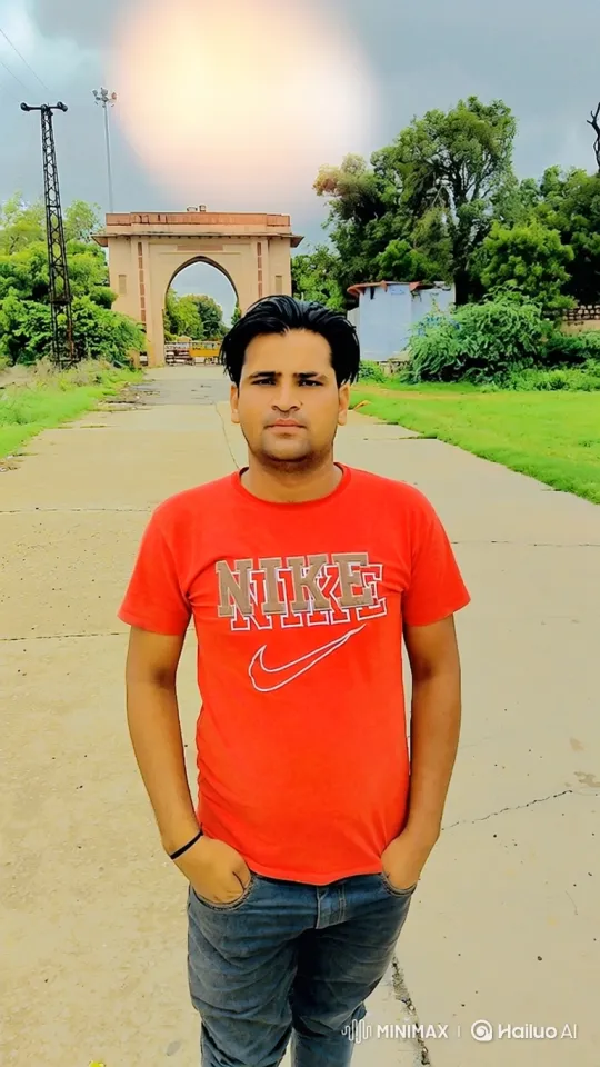 Young Man Stands Still Amidst Gentle Breeze and Swaying Trees – AI Generated Video | Hailuo AI