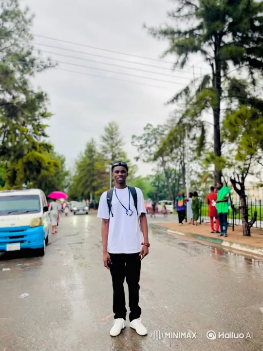 Young Man Walks Down Wet Street Amidst Busy Scene – AI Generated Video | Hailuo AI