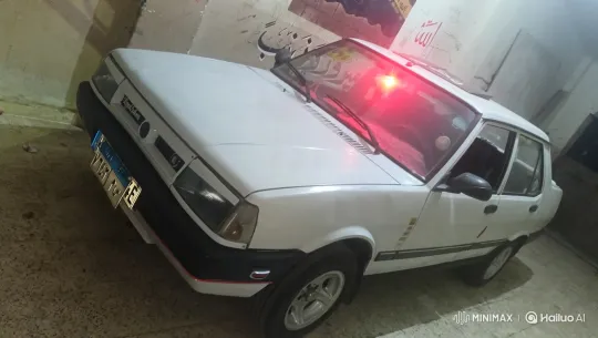 Vibrant Red Light and Complex Camera Movements Showcase a White Sedan in a Dimly Lit Space – AI Generated Video | Hailuo AI