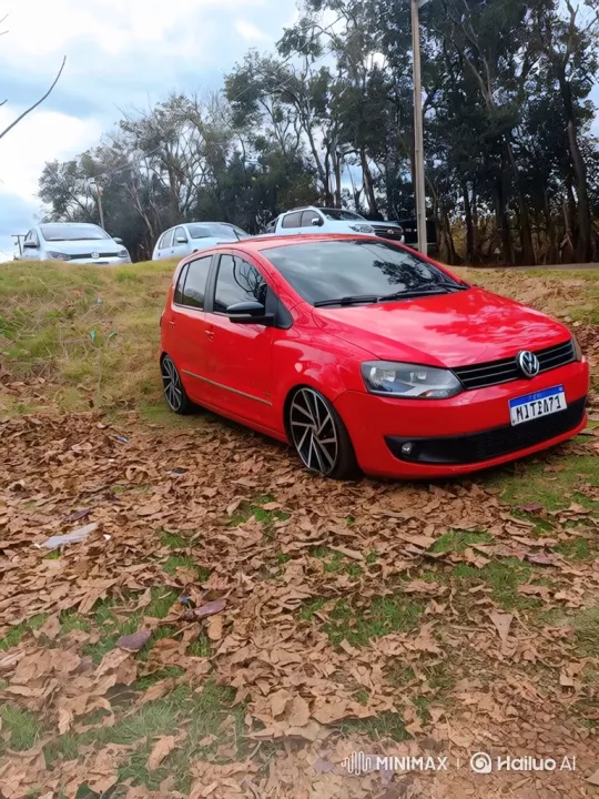 Red Hatchback Lowering Its Suspension on Grass – AI Generated Video | Hailuo AI