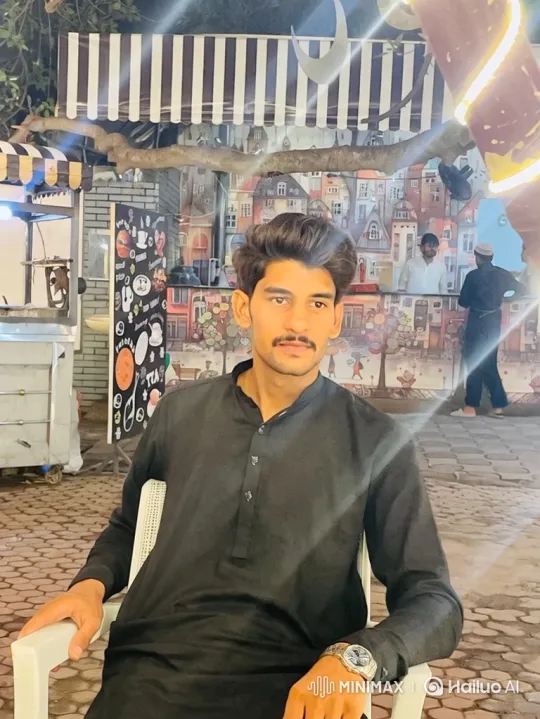 Young Man in White Chair Checks Watch at Night – AI Generated Video | Hailuo AI