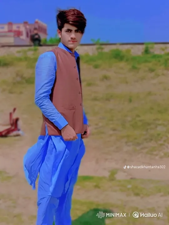 Young Man in Flowing Attire Amidst Gentle Breeze – AI Generated Video | Hailuo AI