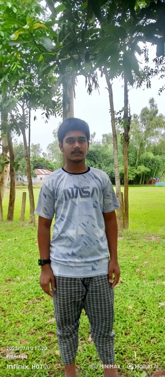 Young Man Stands Still in Lush Field, Capturing Tranquility – AI Generated Video | Hailuo AI