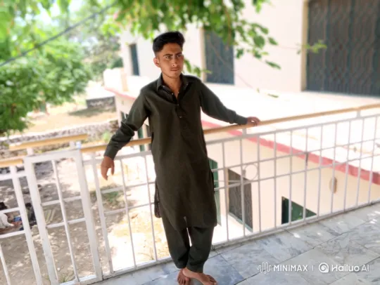 Young Man Reflects on Sorrow in Sunlit Balcony Scene – AI Generated Video | Hailuo AI