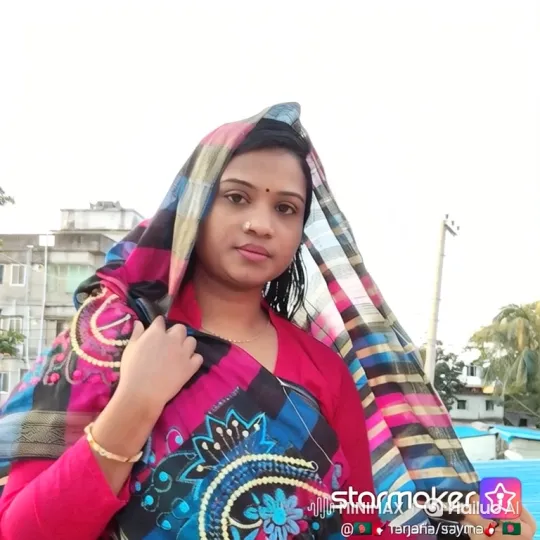 Woman on Rooftop: Serene Presence Amidst Gentle Breeze – AI Generated Video | Hailuo AI