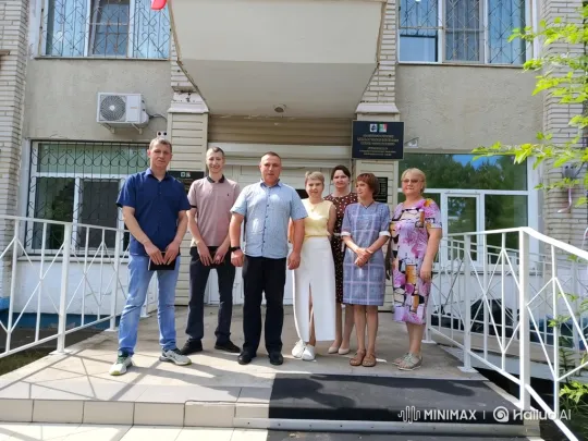 Seven People Pose at Building Entrance – AI Generated Video | Hailuo AI