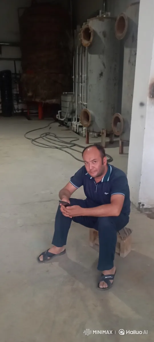 Middle-aged Man Greeting with Smile in Industrial Setting – AI Generated Video | Hailuo AI