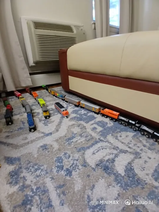 Toy Trains Movement on Patterned Rug – AI Generated Video | Hailuo AI